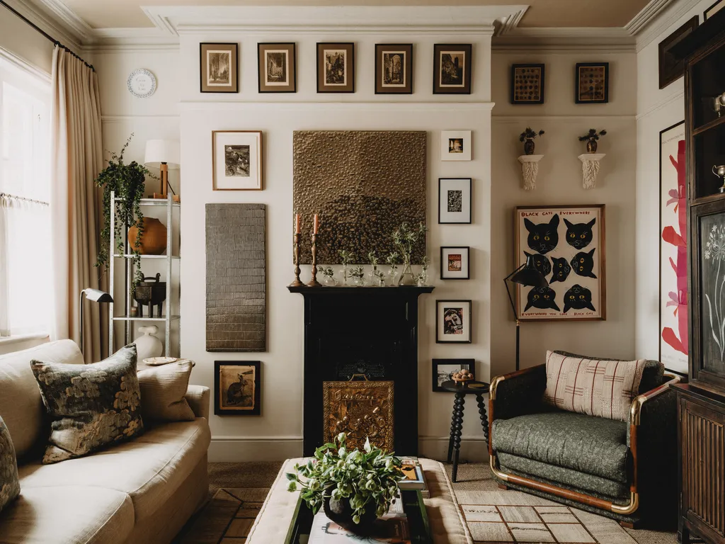 Hotel lounge with tall windows, seating and framed work on the walls